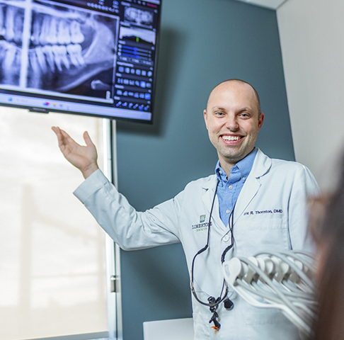 Jeffersonville dentist showing a patient an X-ray